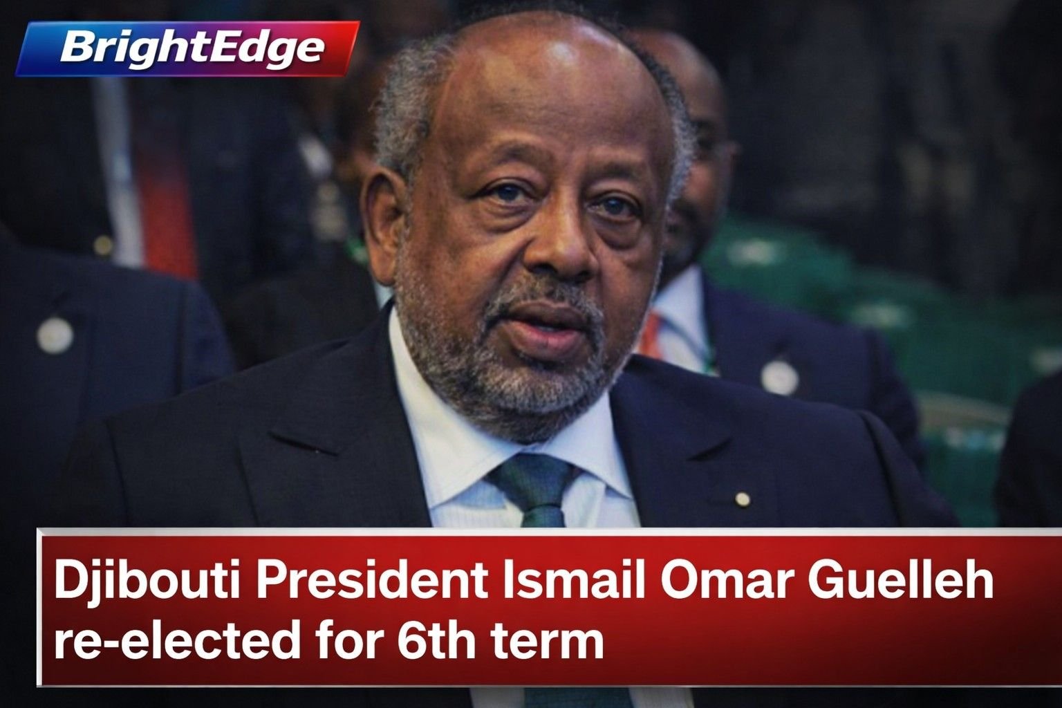 Djibouti President Ismail Omar Guelleh seated at an official event, wearing a dark suit and tie, with a blurred background of delegates, alongside headline text announcing his re-election for a sixth term.